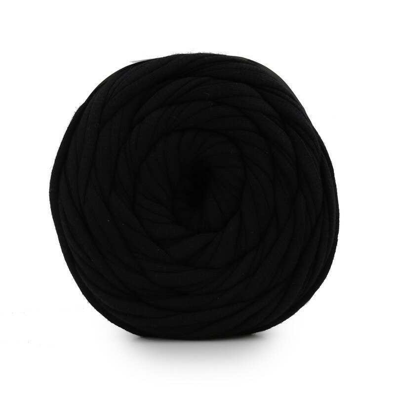 Black yarn ball on a white background