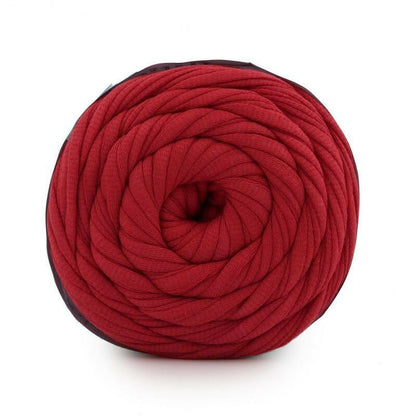 Red yarn ball on a white background