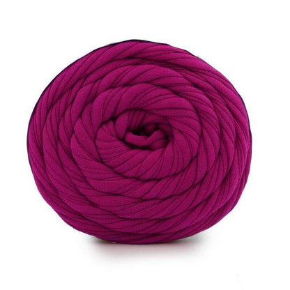 Purple yarn ball on a white background