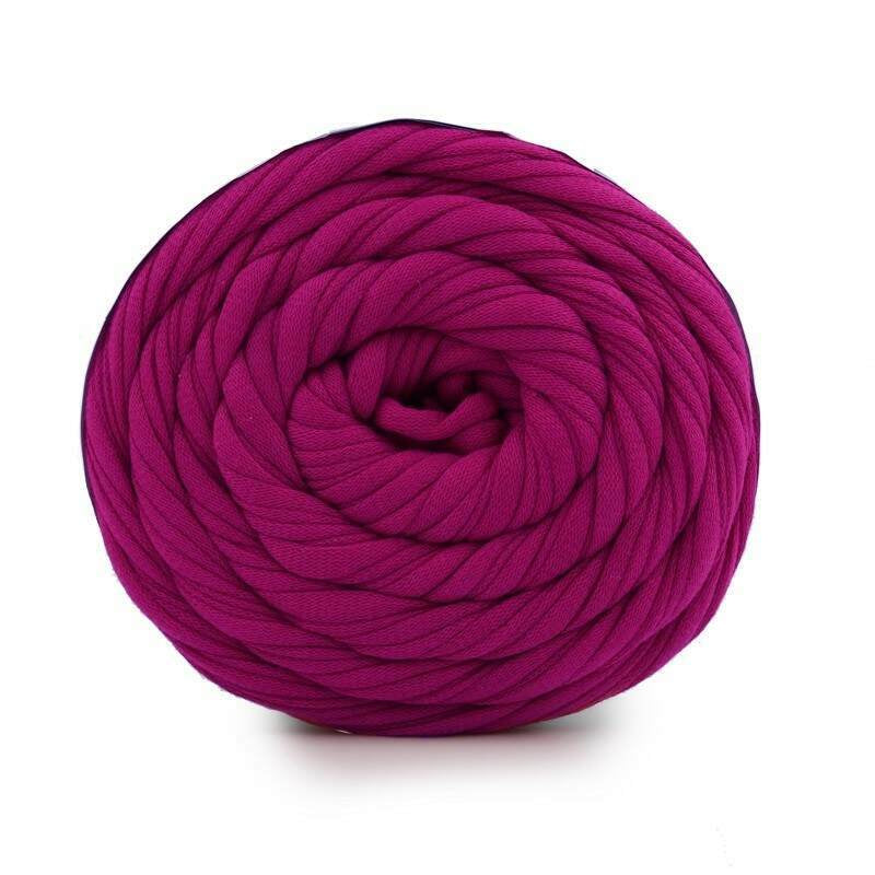 Purple yarn ball on a white background