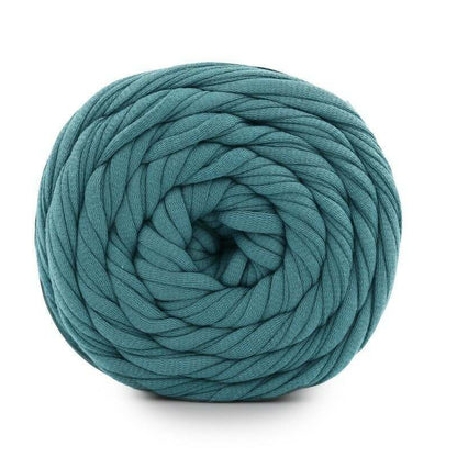 Teal skein of yarn on a white background