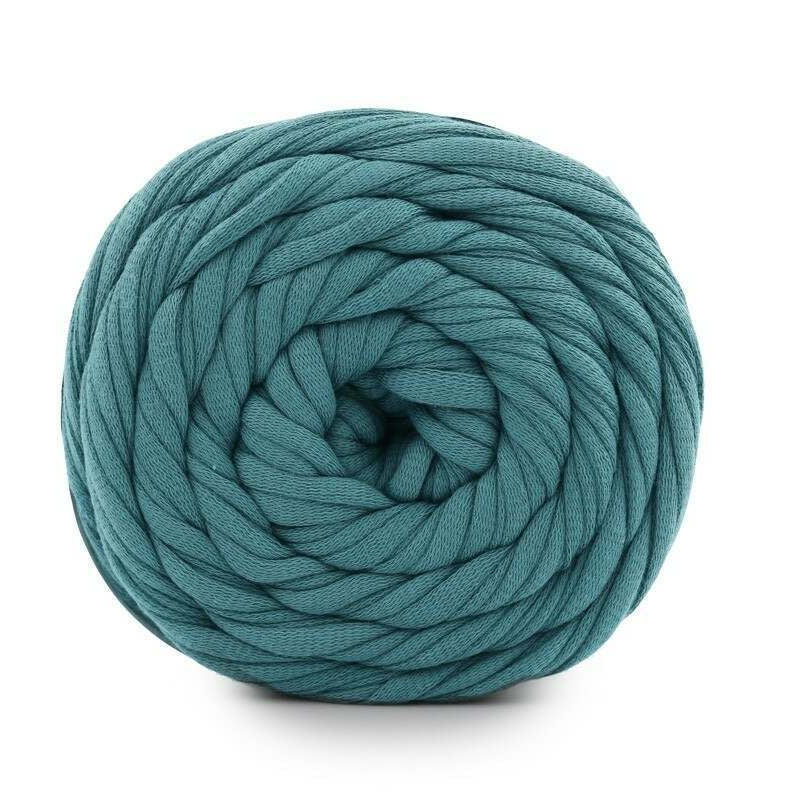 Teal skein of yarn on a white background