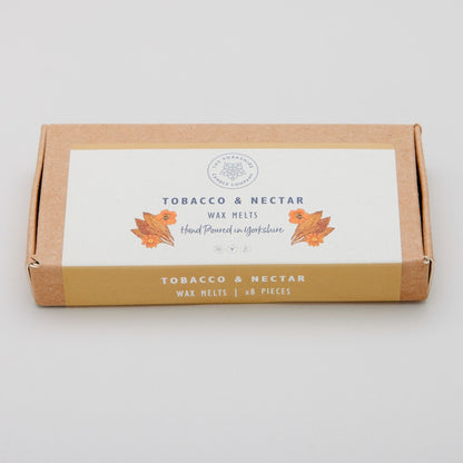 Box of Tobacco & Nectar wax melts on a light gray background