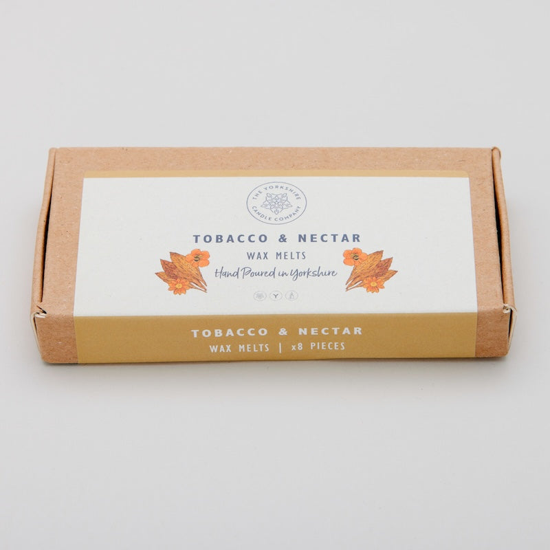 Box of Tobacco & Nectar wax melts on a light gray background